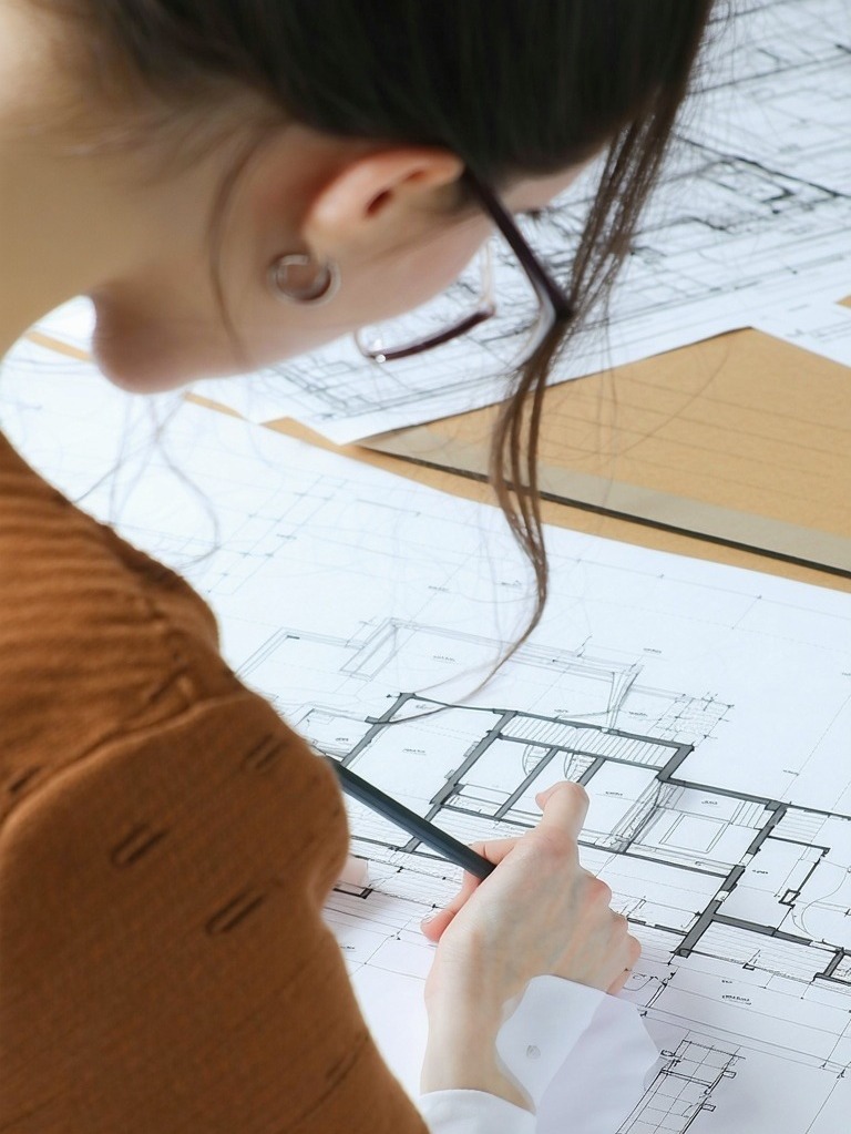 female architect drafting blurry-1-1-1