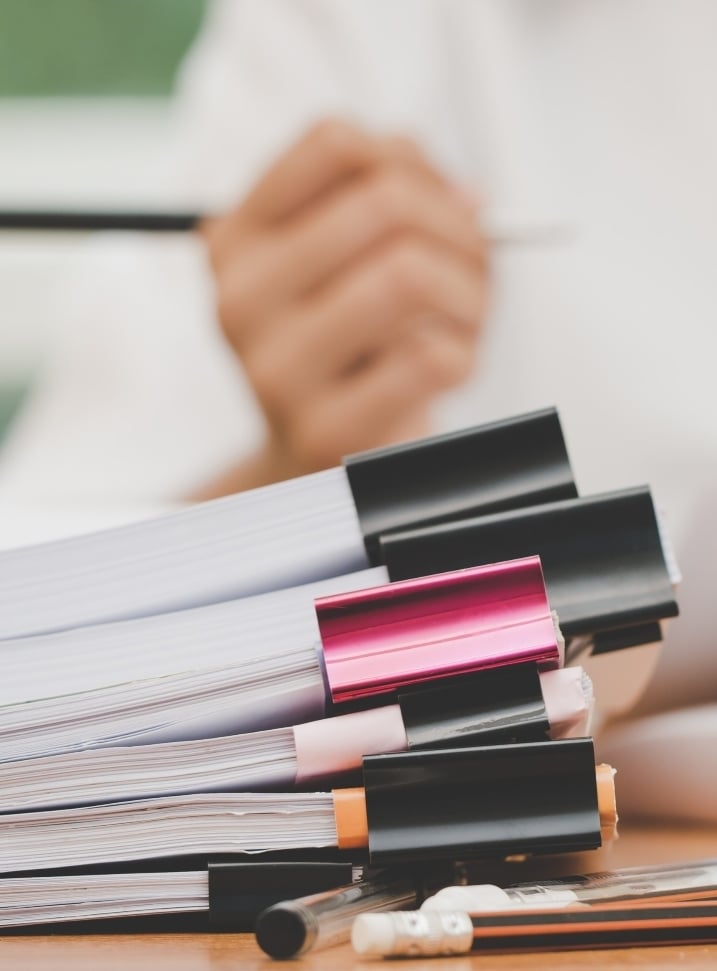 woman with files iStock-1136513274 3
